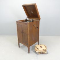 An early 20th century Dulcetto Gramophone cabinet, with a selection of LPs. Overall 49x96x50cm.
