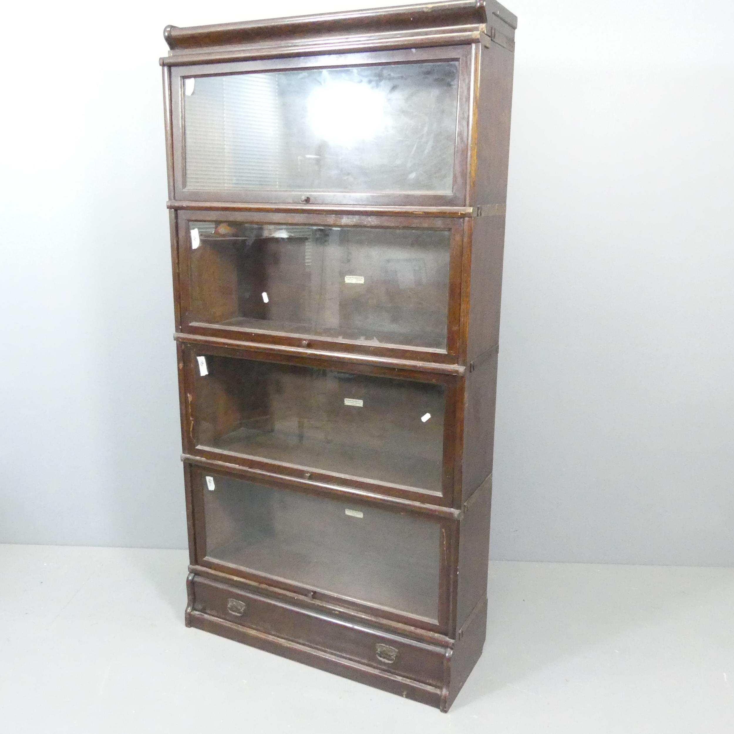 GLOBE WERNICKE - an early 20th century oak four-shelf sectional stacking bookcase, in six parts