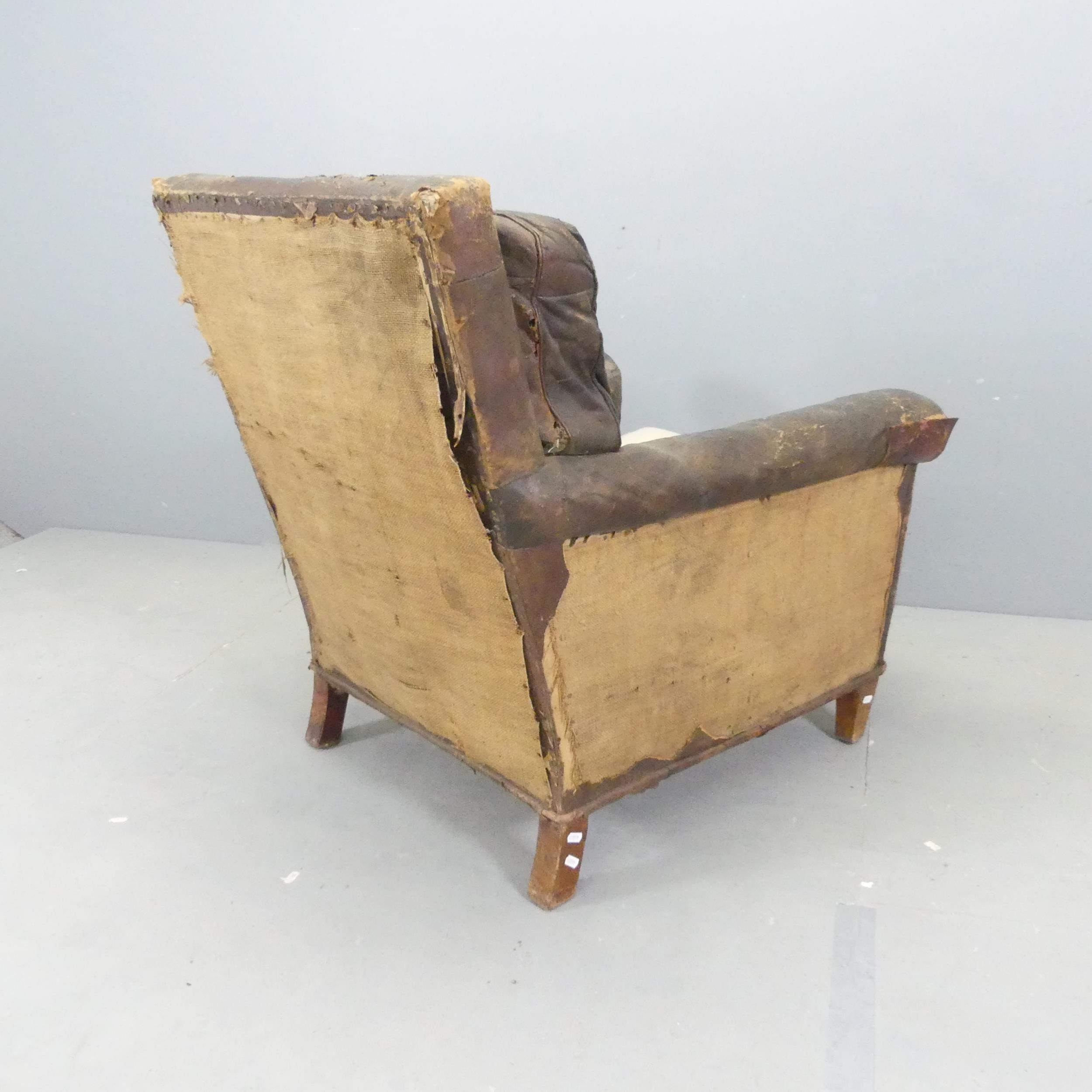 An early 20th century leather upholstered club armchair. Overall 80x90x80cm, seat 50x40x55cm. - Image 2 of 2