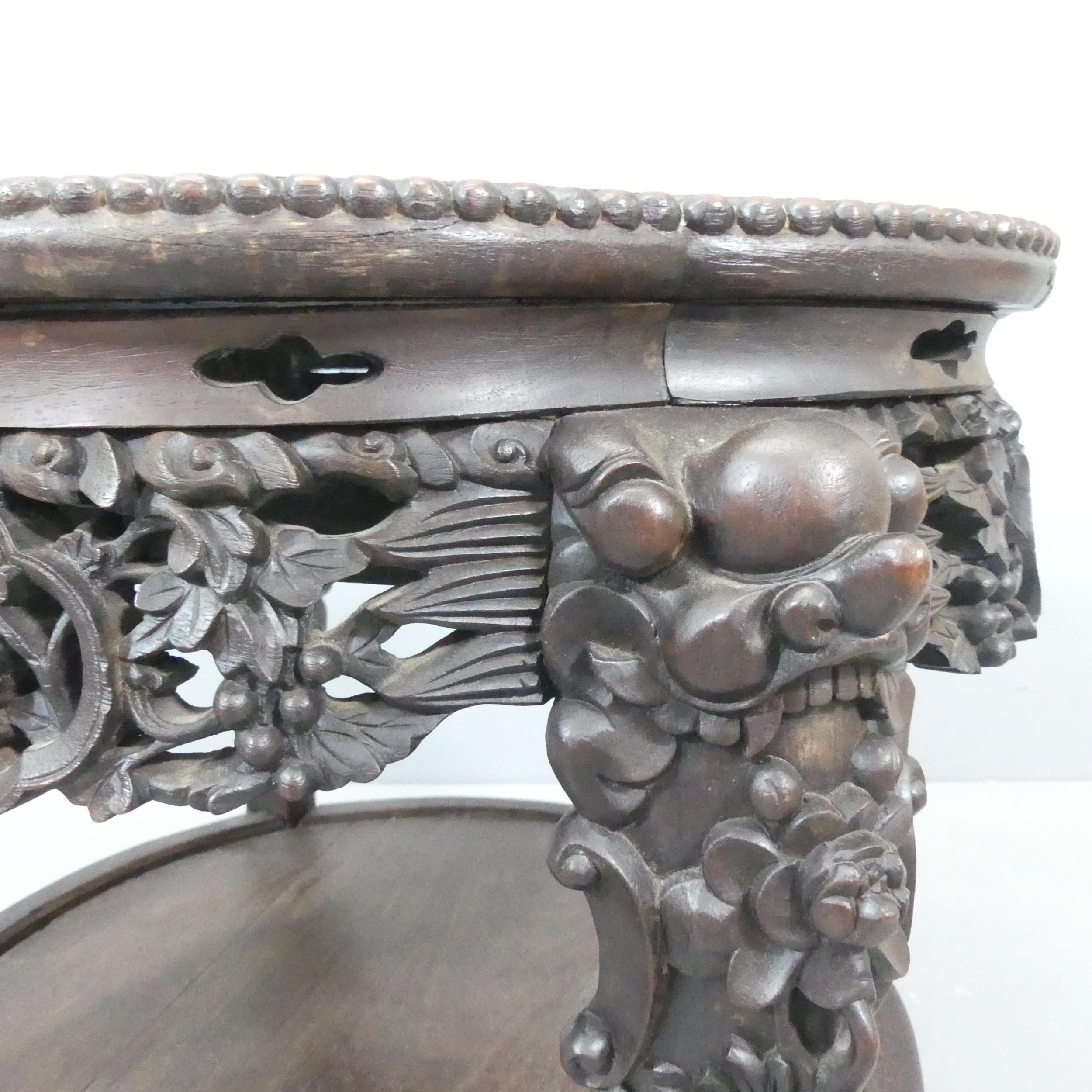 Chinese circular carved hardwood 2-tier table, with inset marble top in carved lobed surround, - Image 3 of 3