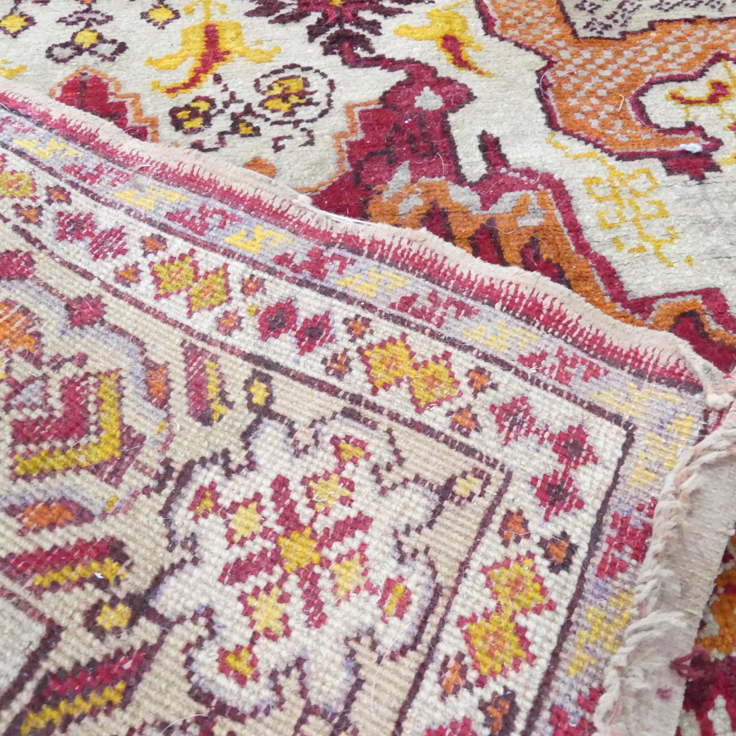 A cream-ground Persian rug. 235x170cm. - Image 2 of 2