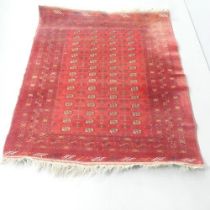 A red-ground Afghan rug. 175x150cm.