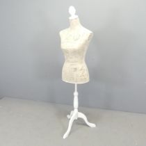 A modern shop-display mannequin, on painted wooden tripod base. Height 142cm.