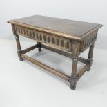 An early 20th century Ipswich Oak style low table. 91x54x45cm