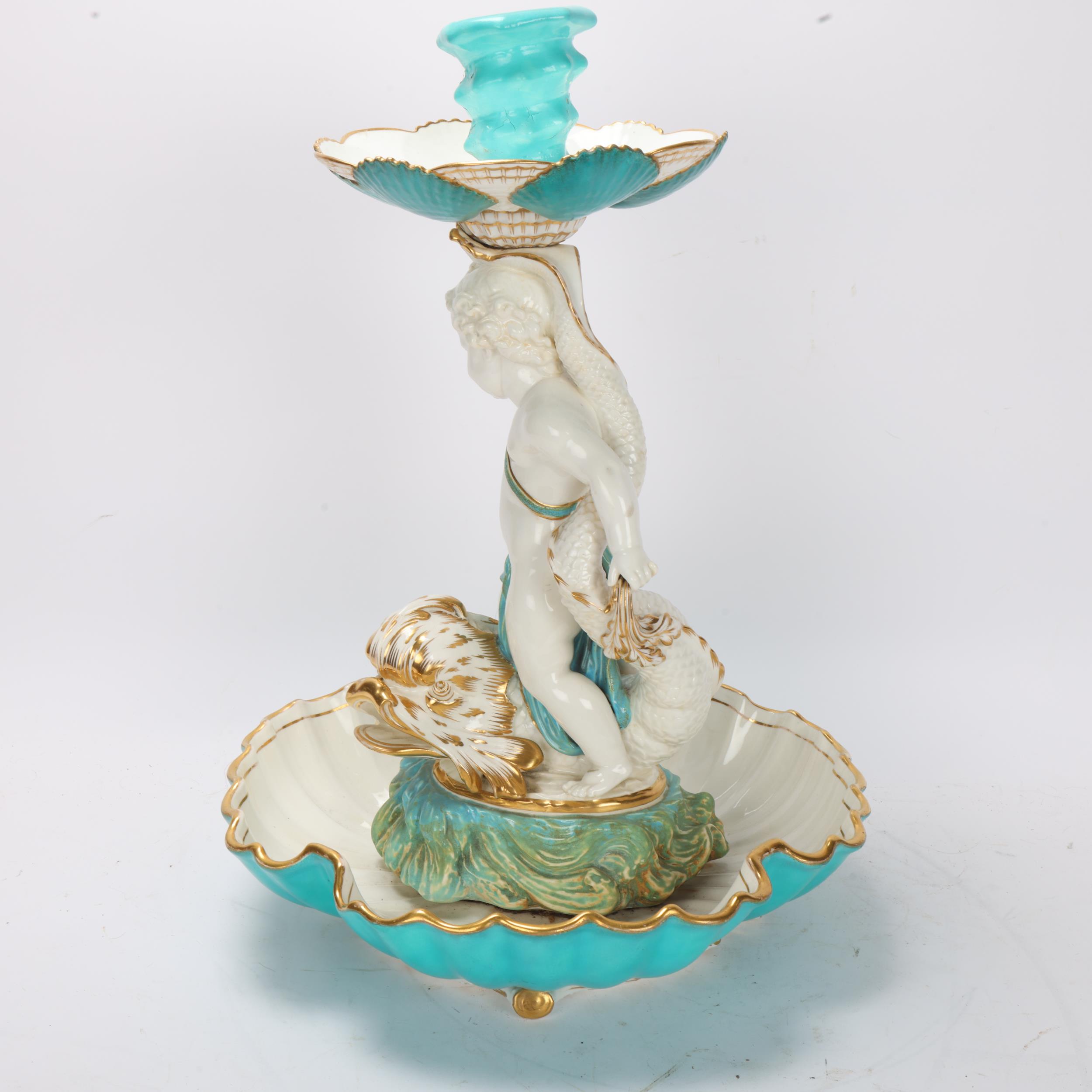 A 19th century ceramic table centre, supported by a cherub riding a gurgle fish, no factory marks, - Image 2 of 3