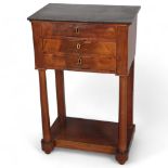 Georges Jacob of Paris, French Empire mahogany 3-drawer side table, circa 1800 - 1810, with black