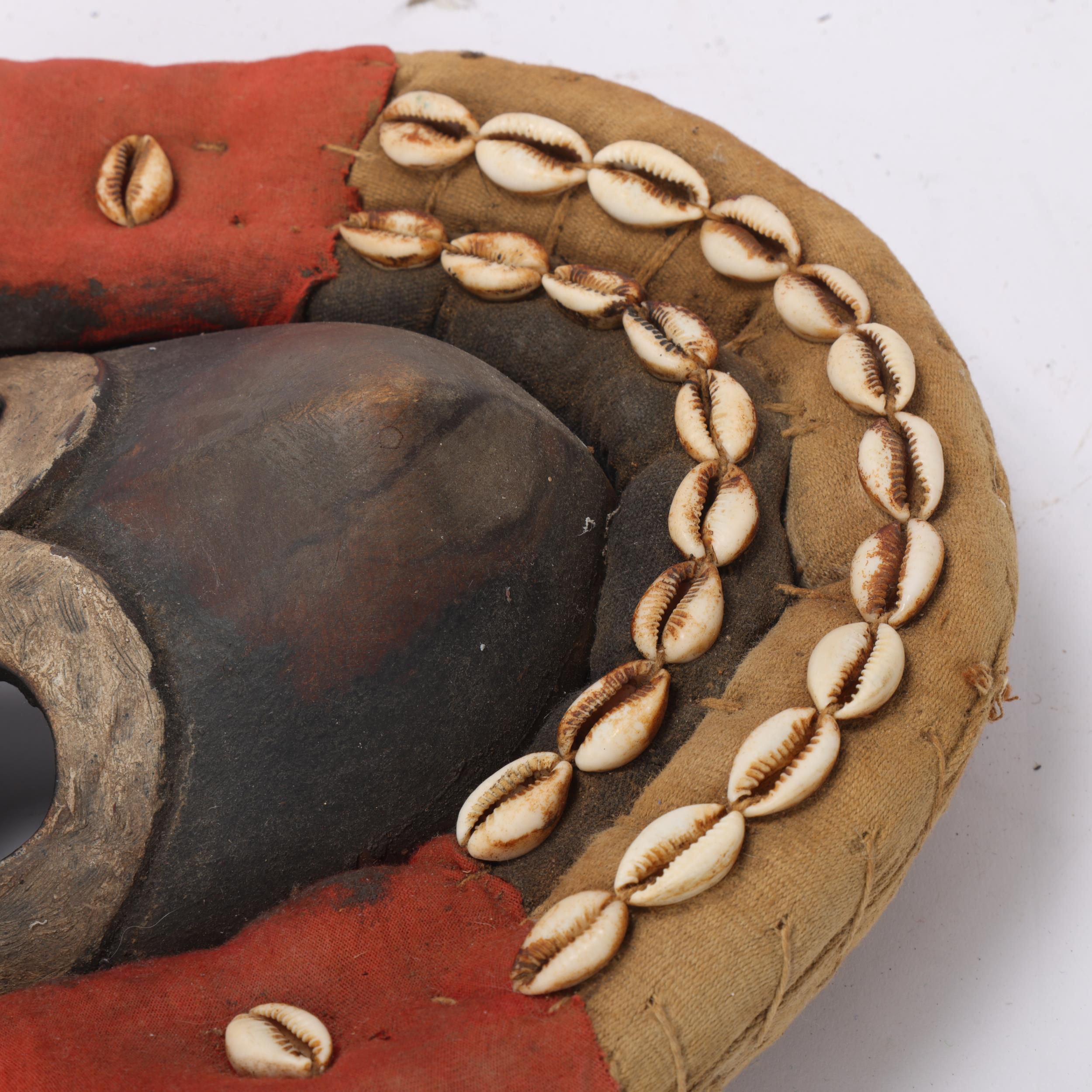 A Dan hardwood Tribal mask in cowrie shell and textile surround, height 31cm - Image 2 of 3