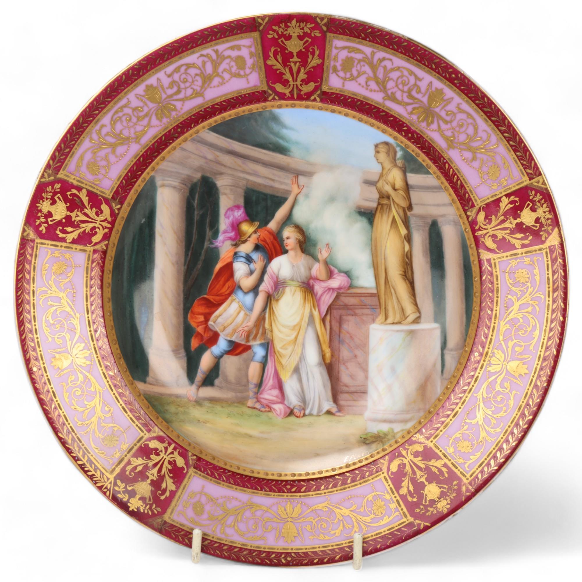 A Vienna porcelain plate depicting Medea in the Temple, gilded border, diameter 23.5cm Good