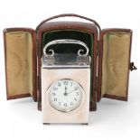 Late Victorian silver carriage clock, enamel dial with glass front and scrolled swing handle, by