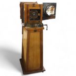 A large Victorian floor standing studio camera, mahogany and brass, with inter-changeable plate