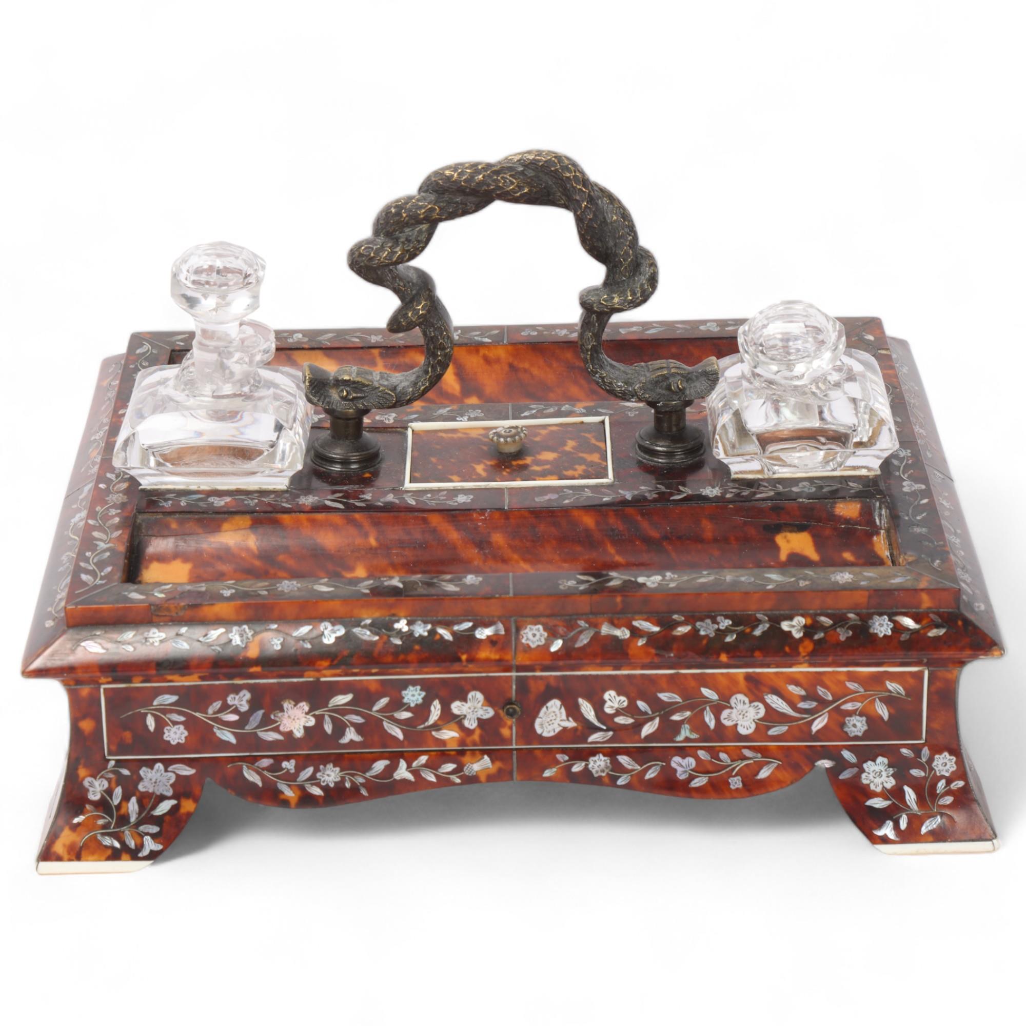 A Victorian tortoiseshell desk stand, with bronze serpent handle, inlaid mother-of-pearl and