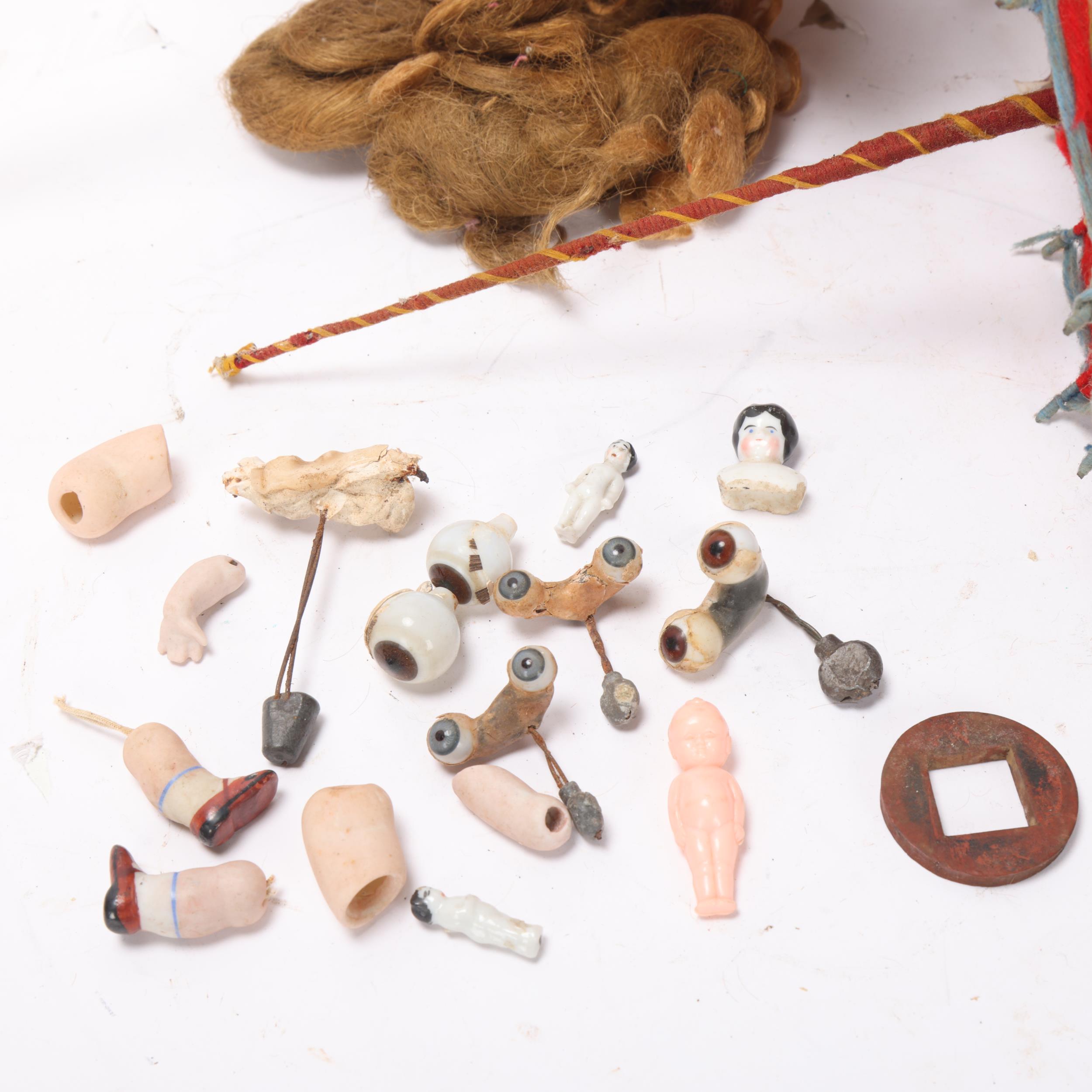 A collection of doll related items, doll's house items, spare limbs, peg doll and a book, The - Image 2 of 3