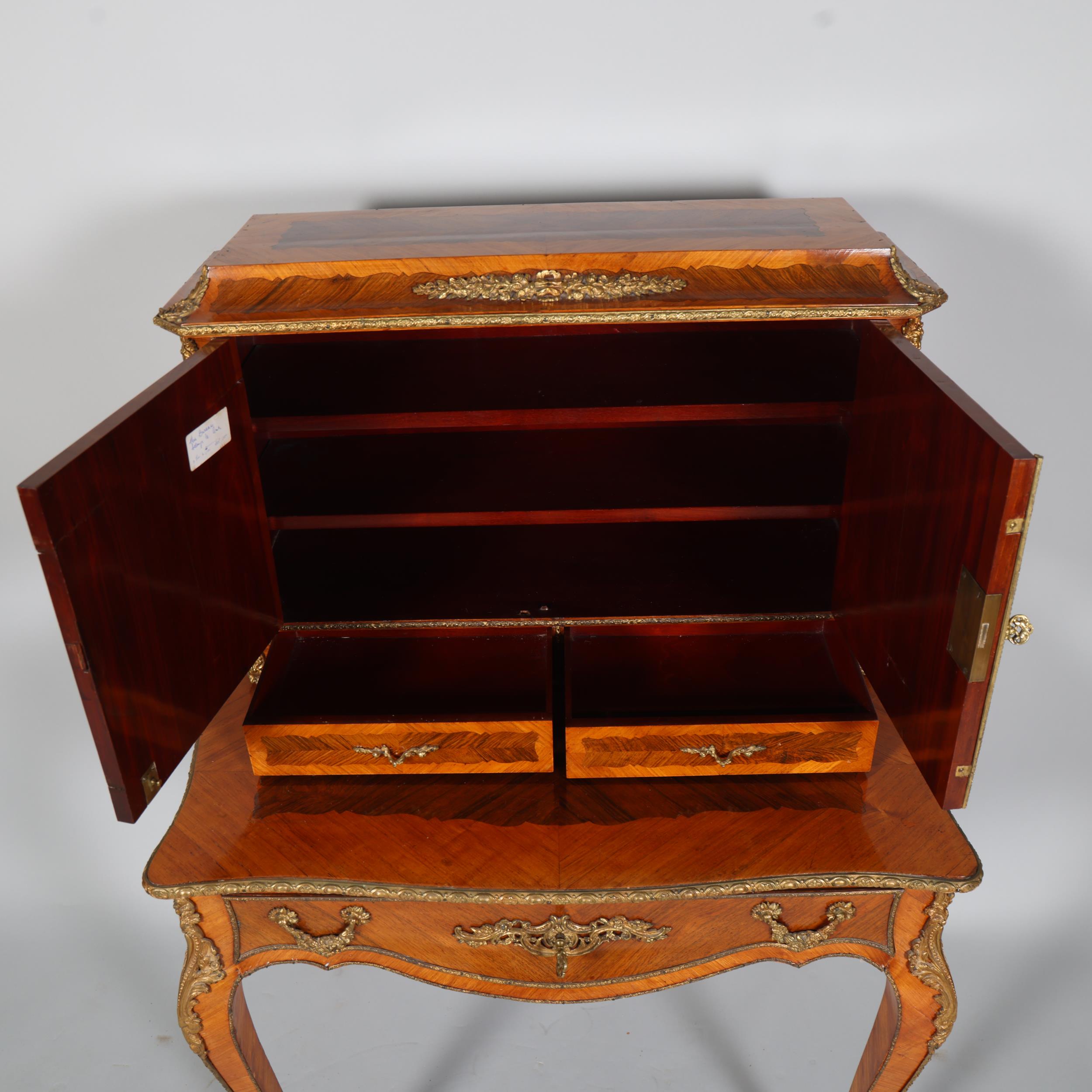 An ornate French kingwood and rosewood writing desk, circa 1900, the upper part fitted with 2 - Image 6 of 9