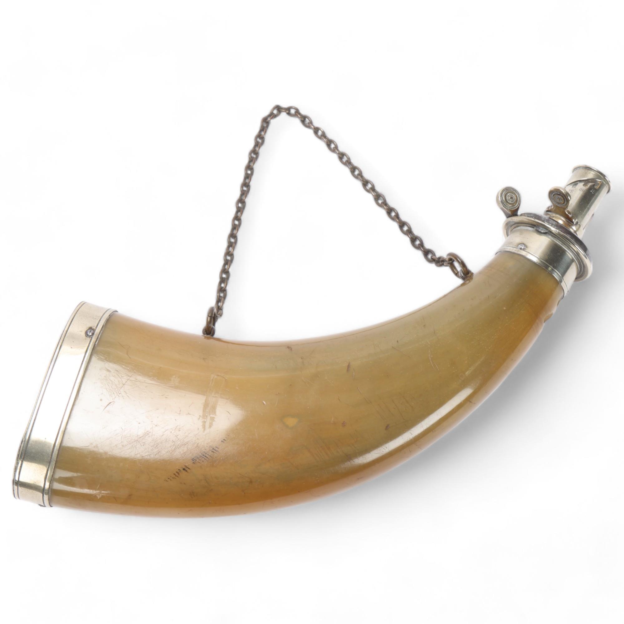 A 19th century buffalo horn powder flask with nickel plate mounts, length 26cm 2 chips just below