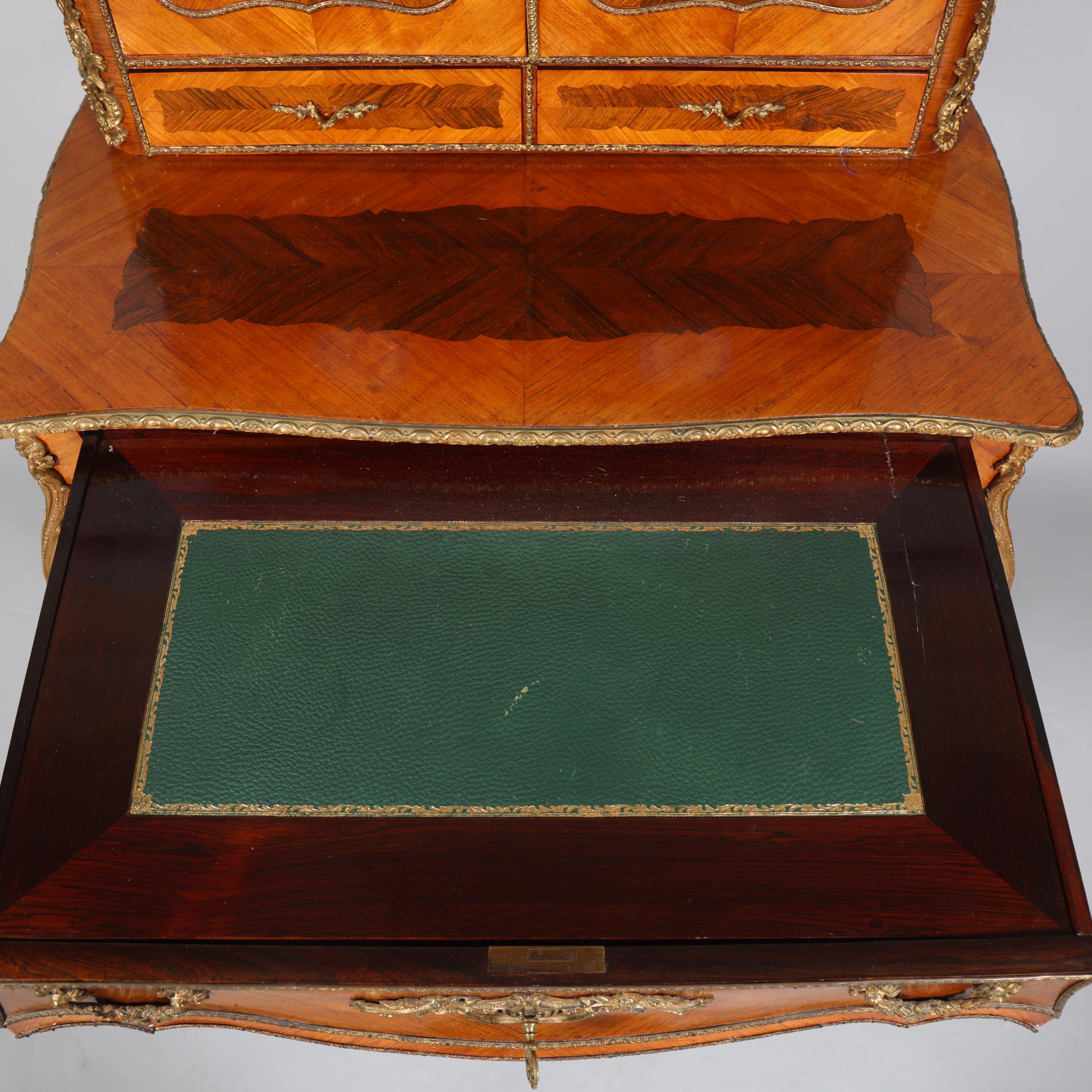 An ornate French kingwood and rosewood writing desk, circa 1900, the upper part fitted with 2 - Image 8 of 9