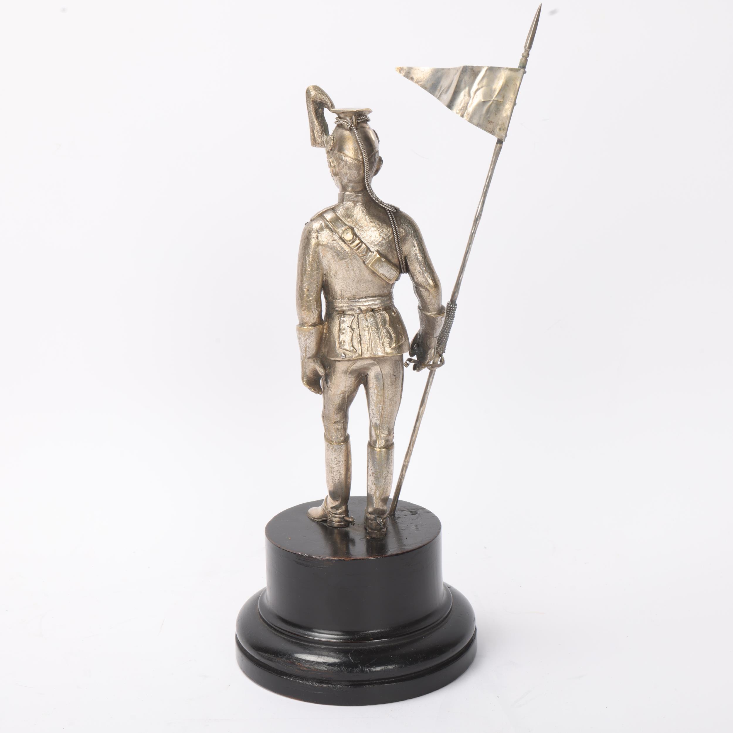 A 19th century electroplate figure of a Standard Bearer from the 12th Lancers, ebonised base with - Image 3 of 3