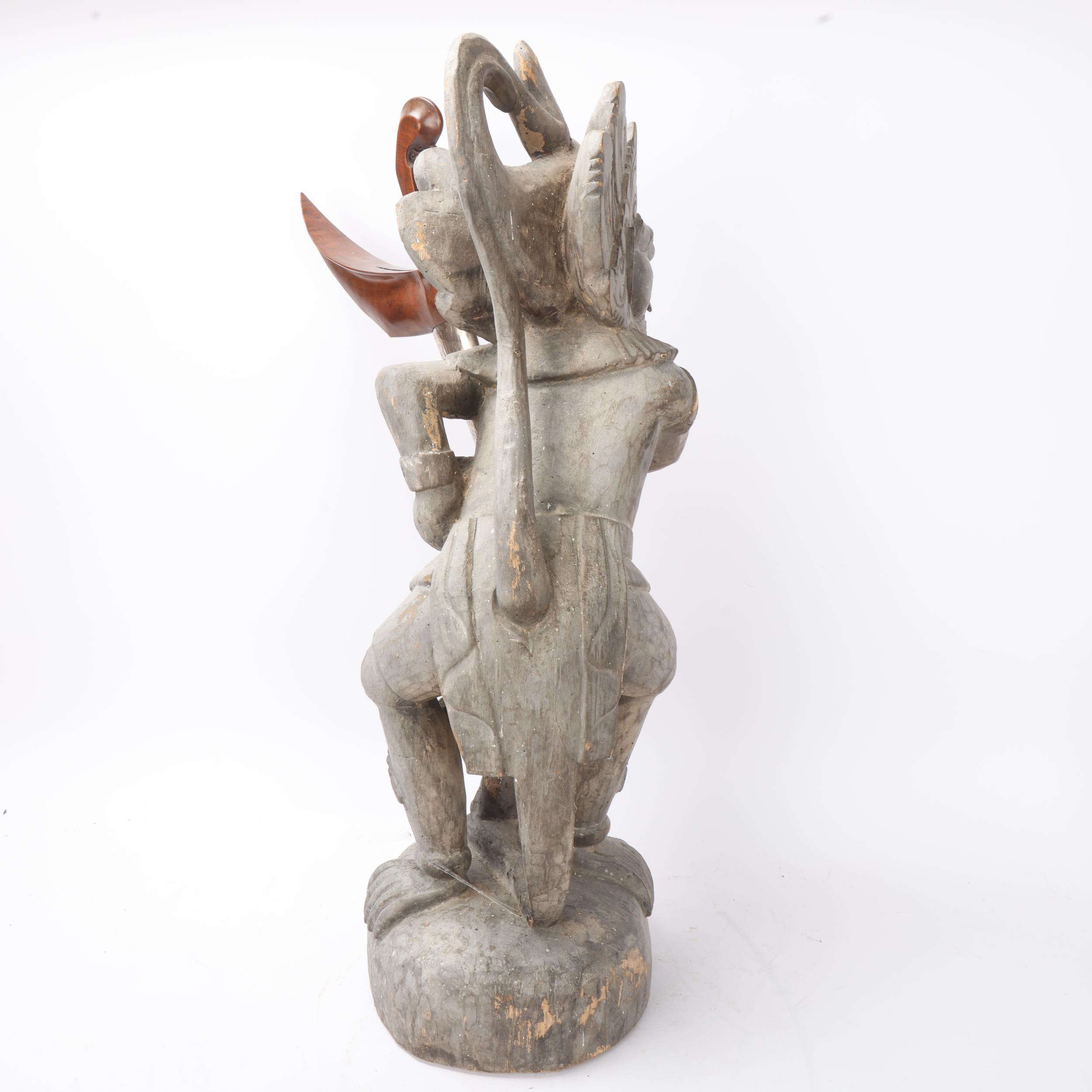 A Malayan carved wood grotesque figure Kris stand, together with a Kris dagger in white metal - Image 3 of 3