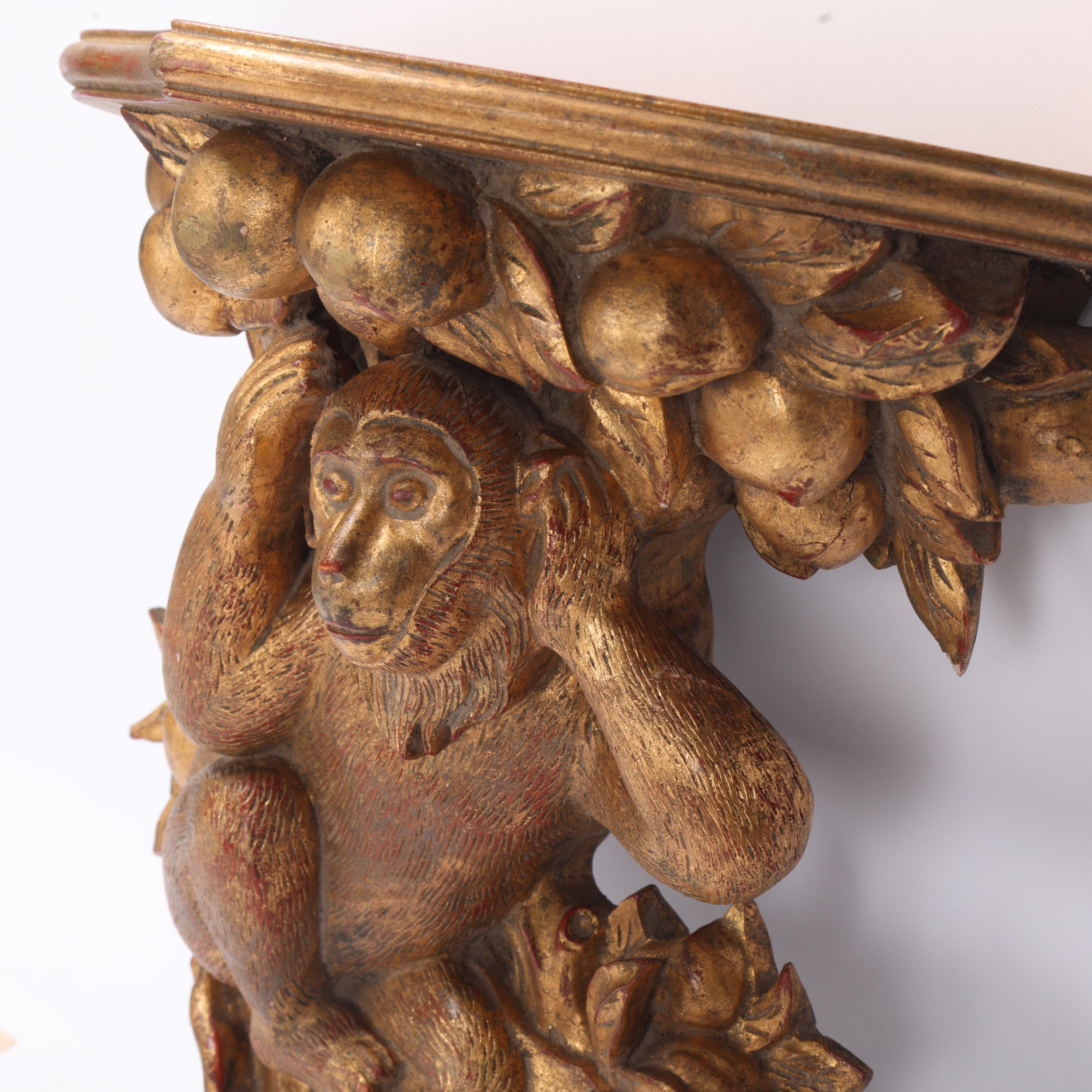 A carved giltwood shelf bracket, supported by a monkey, height 36cm Good condition, no damage - Image 2 of 3