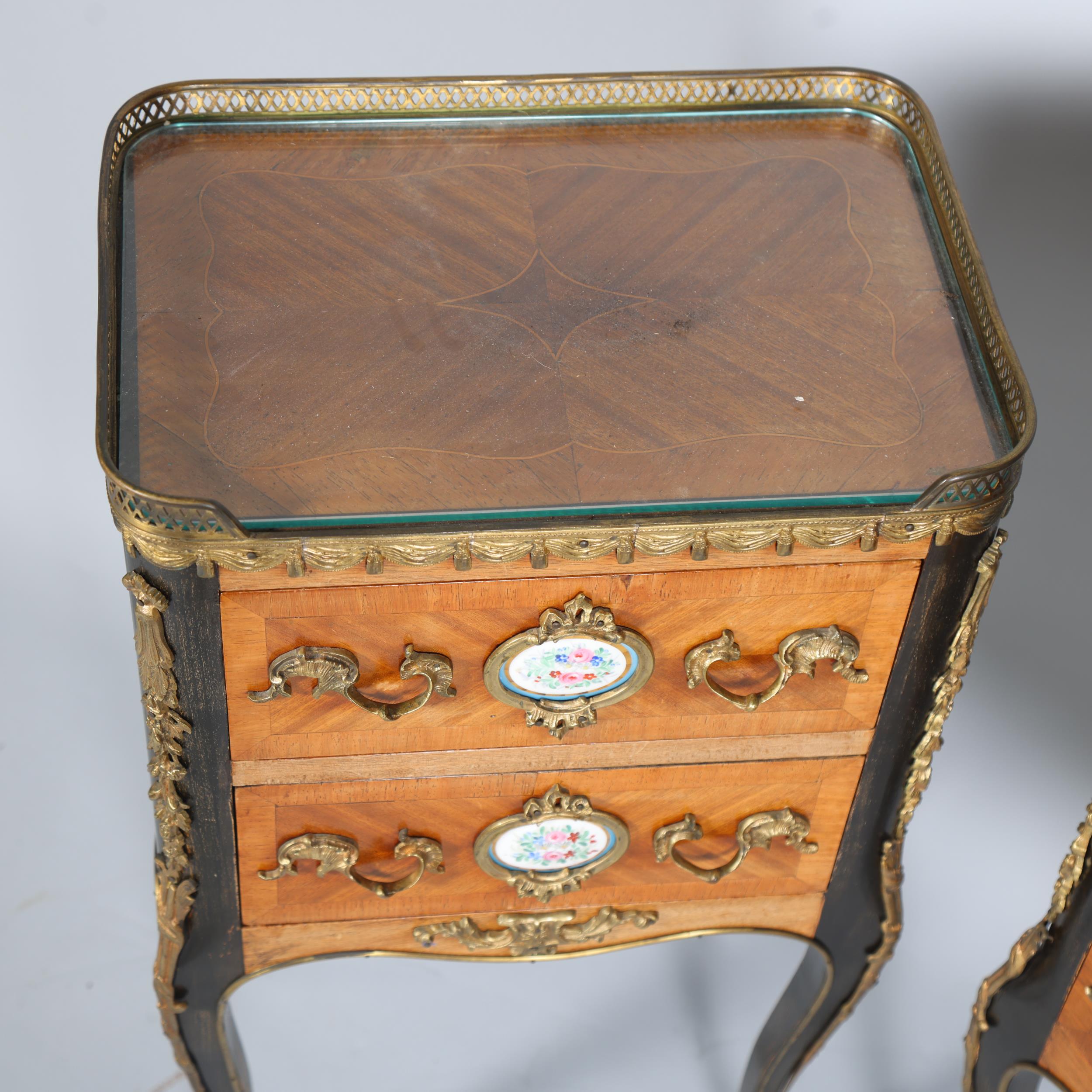 A pair of French walnut 2-drawer bedside chests, inset porcelain plaques to the drawer fronts, brass - Image 4 of 7