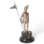 A 19th century electroplate figure of a Standard Bearer from the 12th Lancers, ebonised base with