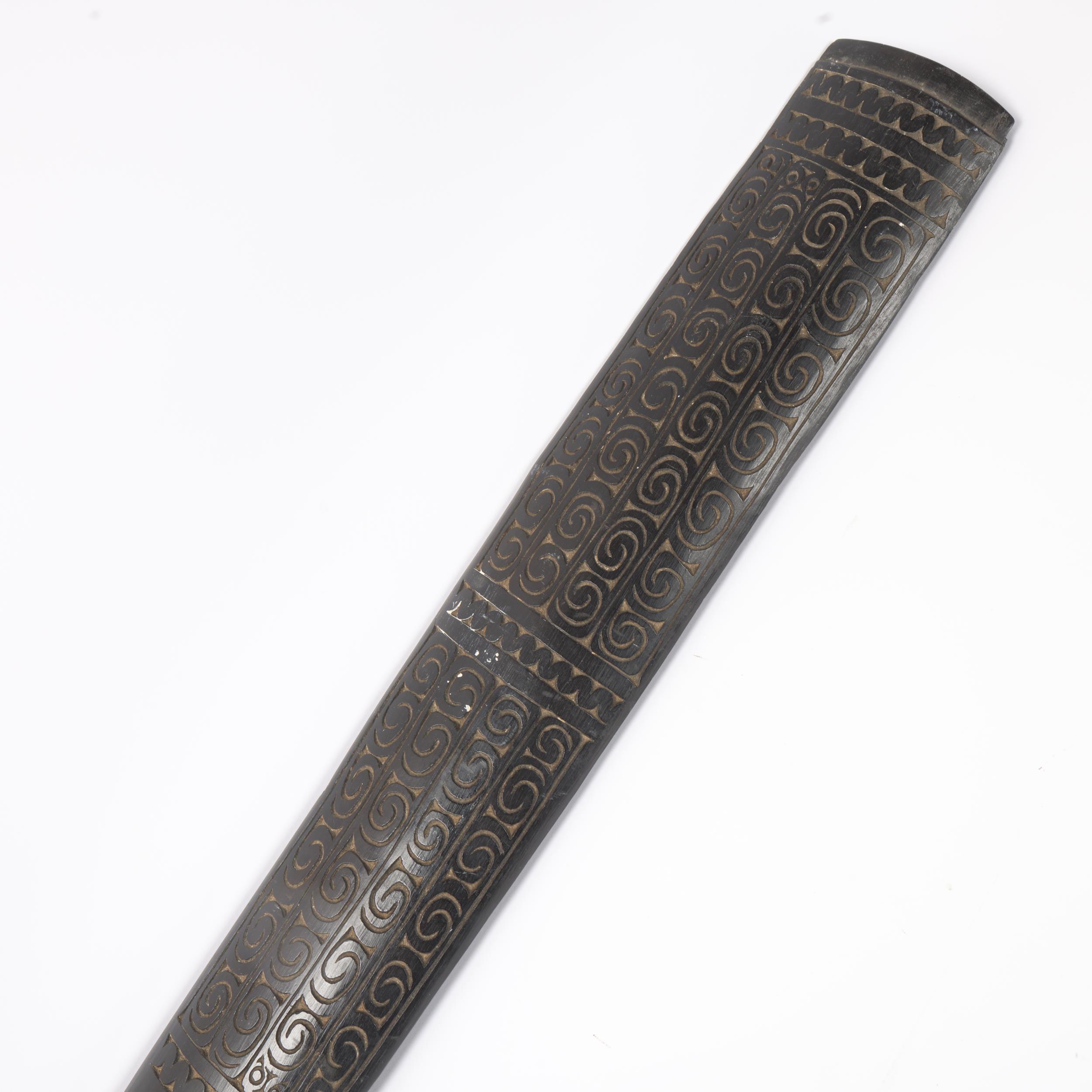 An Oceanic Tribal hardwood sword/club with engraved decoration, length 82cm probably early to mid- - Image 2 of 3