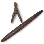 A Senufo carved wood catapult figure, height 17cm, and an Australian Woomera with traces of paint,