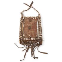 An African Tribal chest plate, with inset mirror decorated with cowrie shells, approx 25cm x 19cm