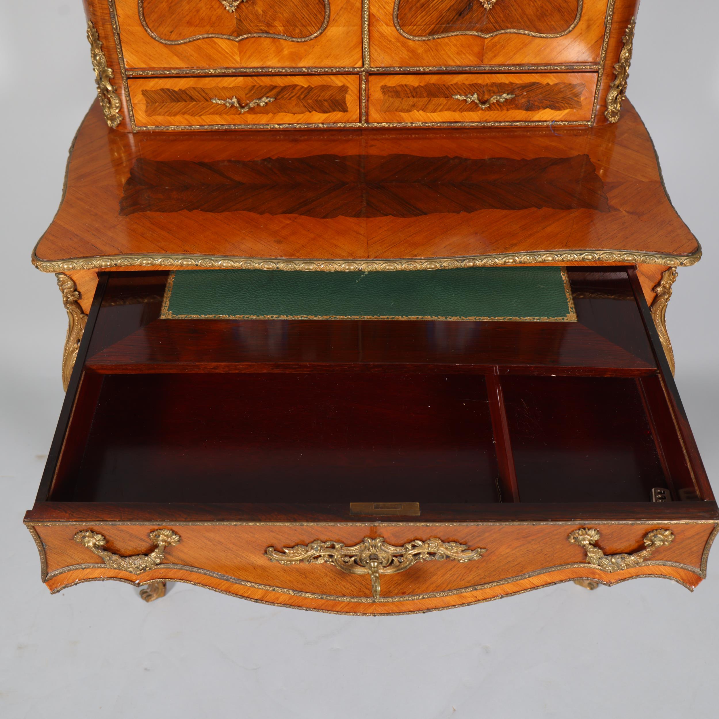 An ornate French kingwood and rosewood writing desk, circa 1900, the upper part fitted with 2 - Image 9 of 9