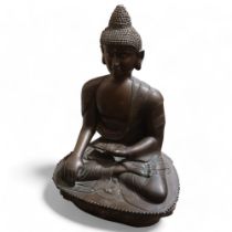 A large Chinese patinated bronze seated Buddha, resting on lotus design base, height 85cm Good