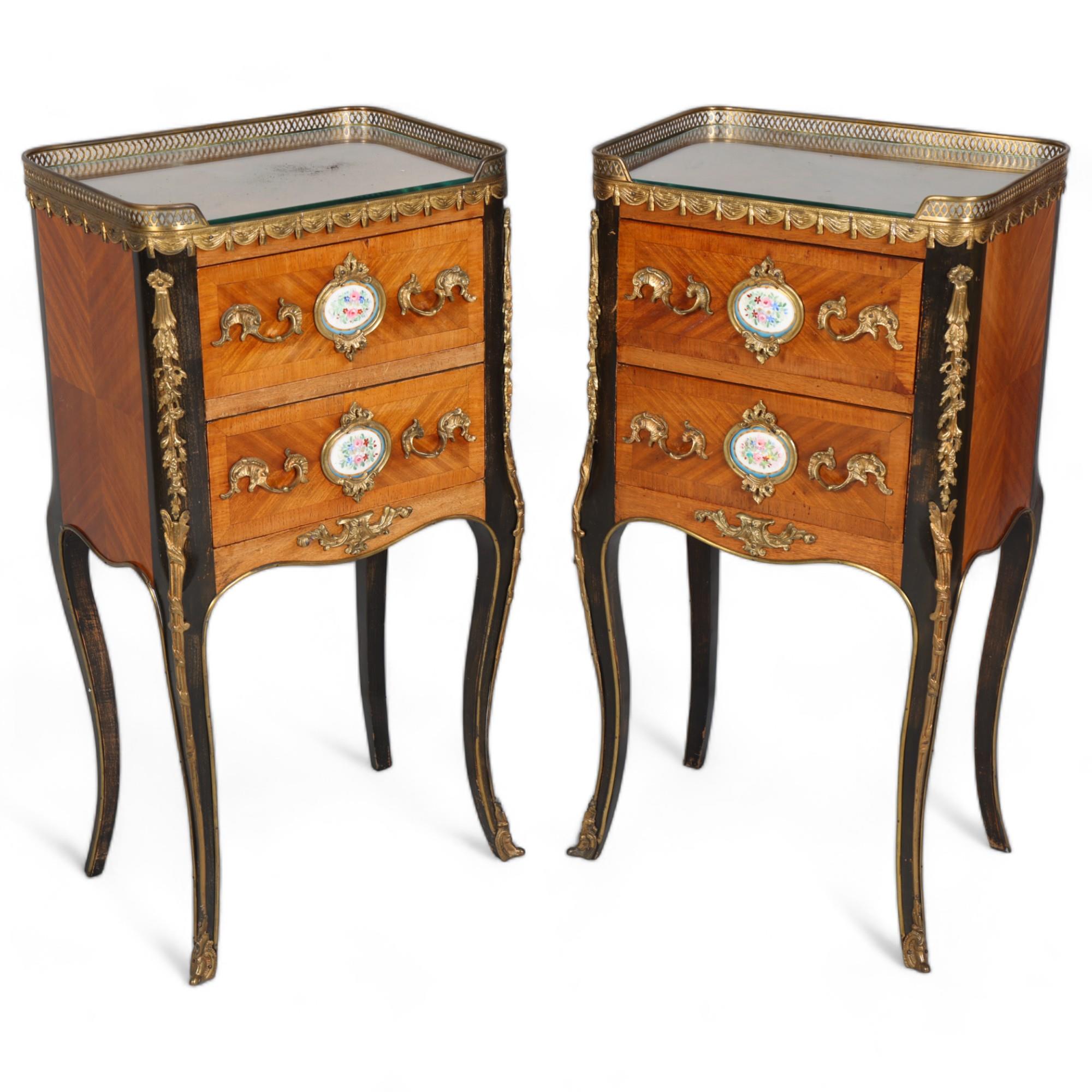 A pair of French walnut 2-drawer bedside chests, inset porcelain plaques to the drawer fronts, brass