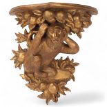 A carved giltwood shelf bracket, supported by a monkey, height 36cm Good condition, no damage