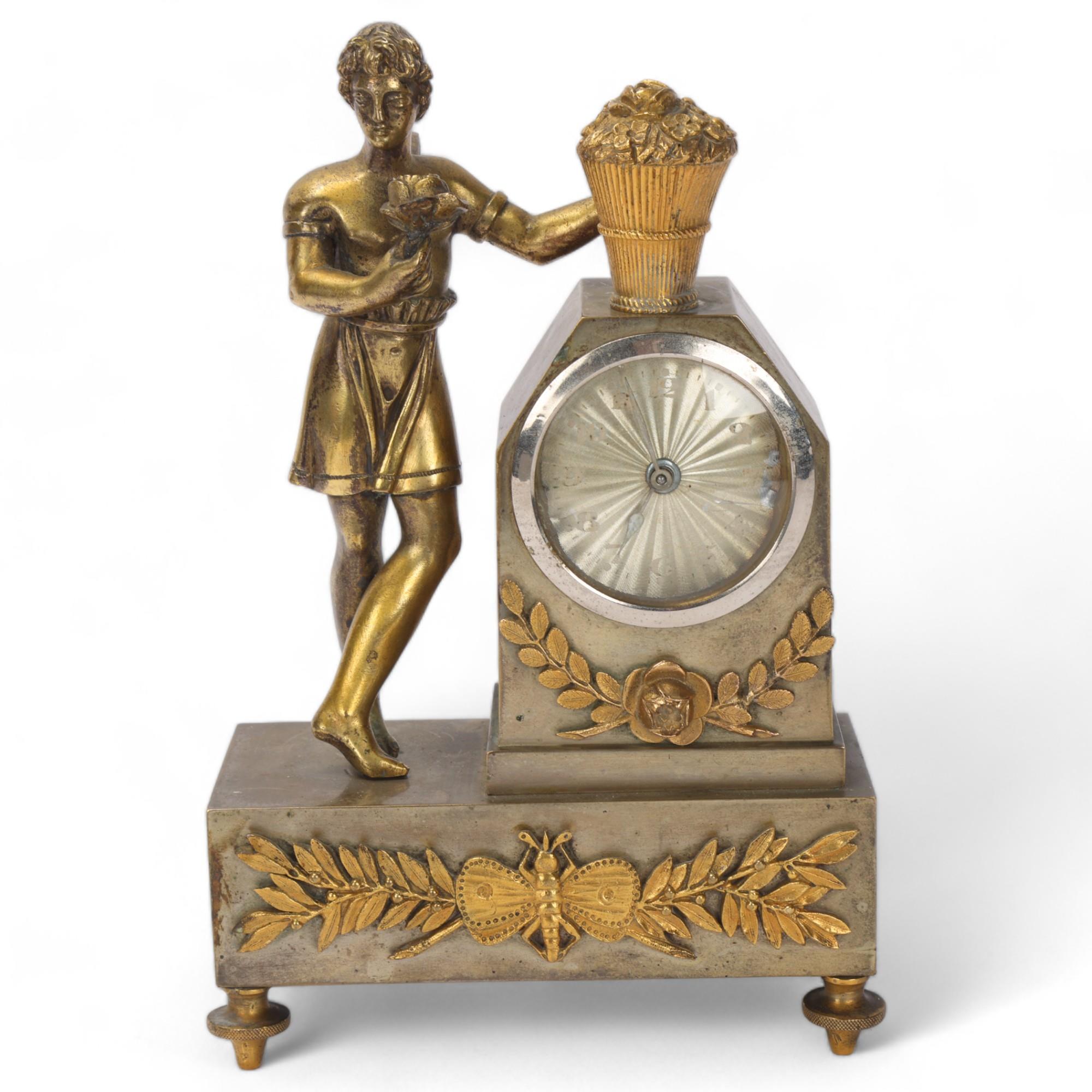 A French parcel-gilt bronze mounted 8-day mantel clock surmounted by an angel figure, spring