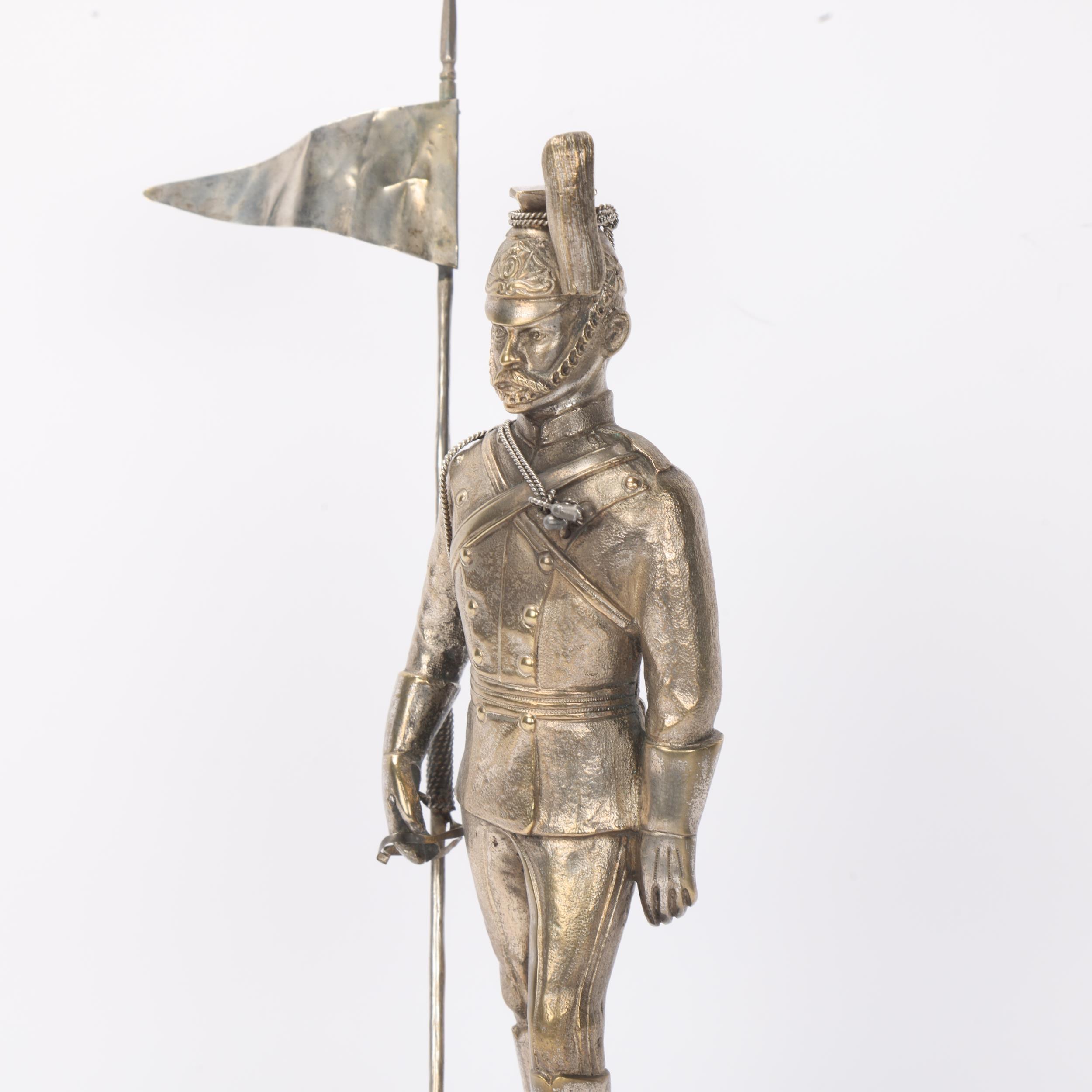 A 19th century electroplate figure of a Standard Bearer from the 12th Lancers, ebonised base with - Image 2 of 3