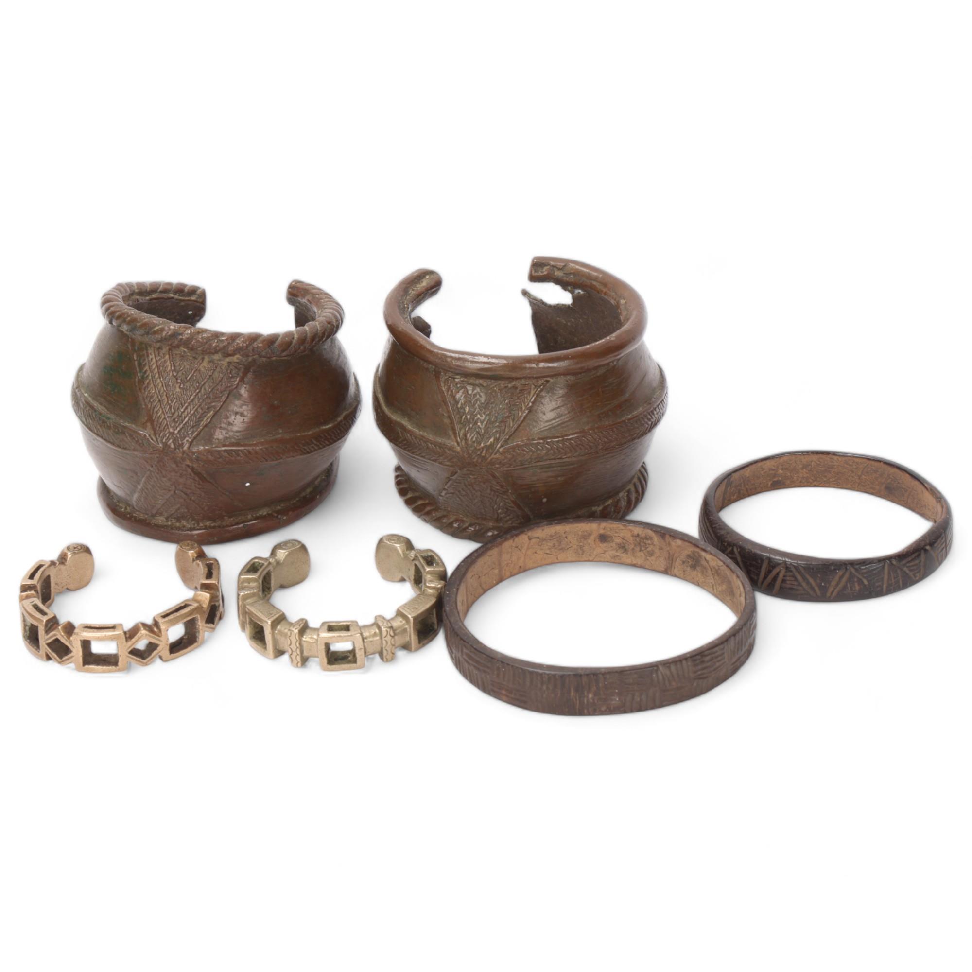 Pair of African bronze bracelets, 2 nickel currency bracelets, and 2 elephant hide bangles
