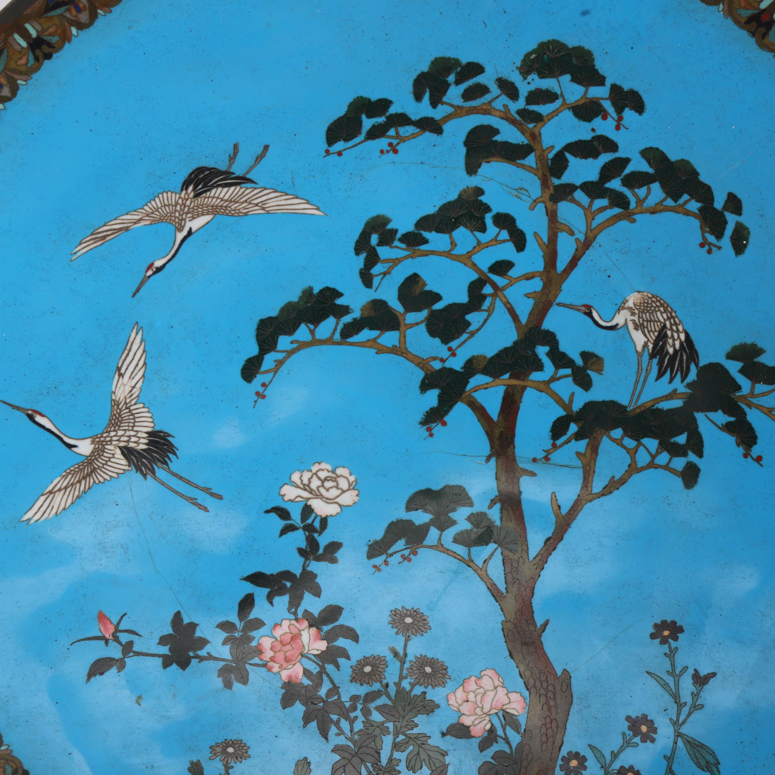 A large pair of Chinese cloisonne enamel wall chargers, decorated with cranes and blossom trees, - Image 2 of 3