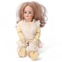 A bisque porcelain-headed girl doll, by Simon & Halbig, length 42cm