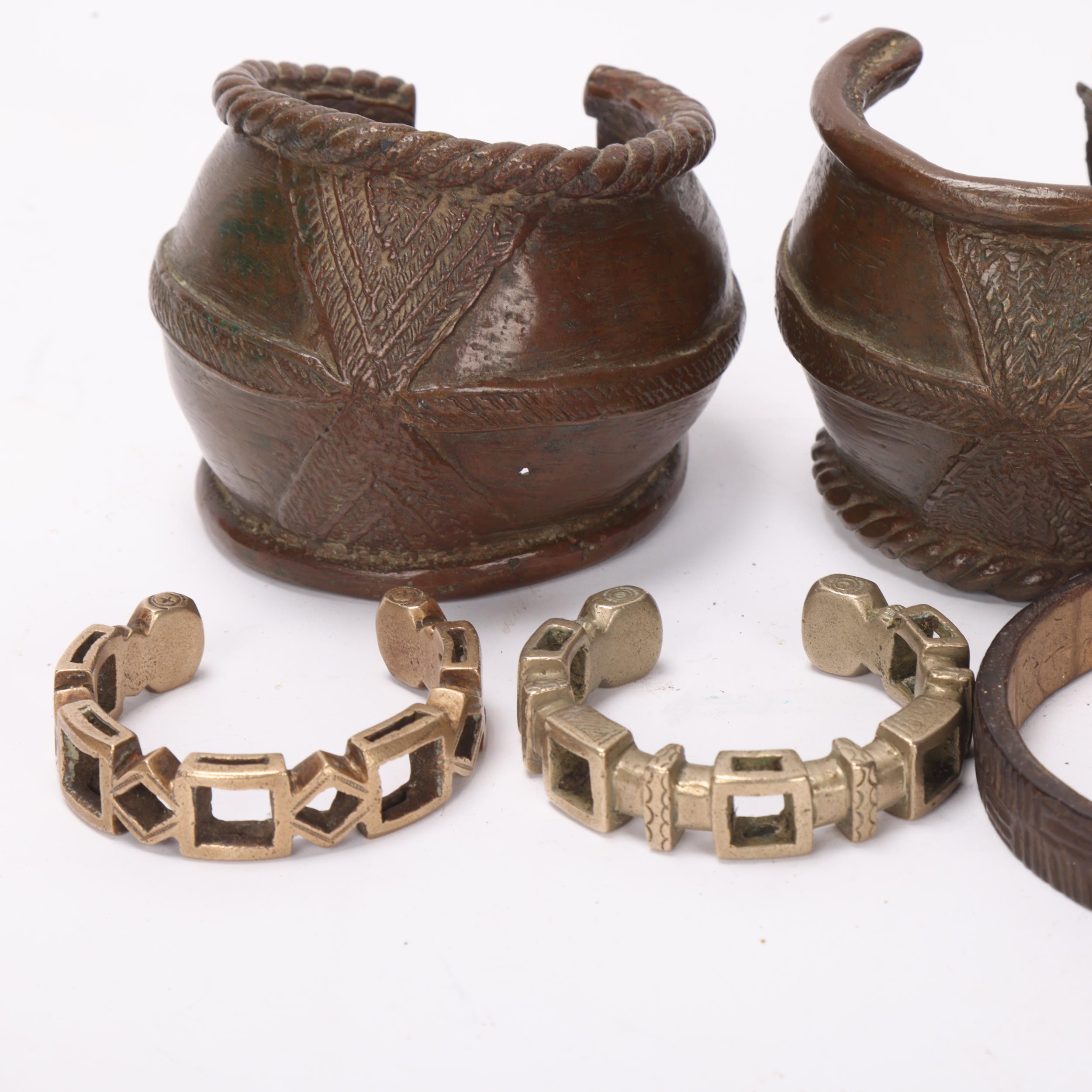 Pair of African bronze bracelets, 2 nickel currency bracelets, and 2 elephant hide bangles - Image 2 of 3