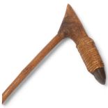 A New Guinea Tribal adze with rattan-bound greenstone blade