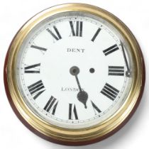 A large brass-cased ship's dial wall clock, by Dent of London, enamel dial on mahogany mount,