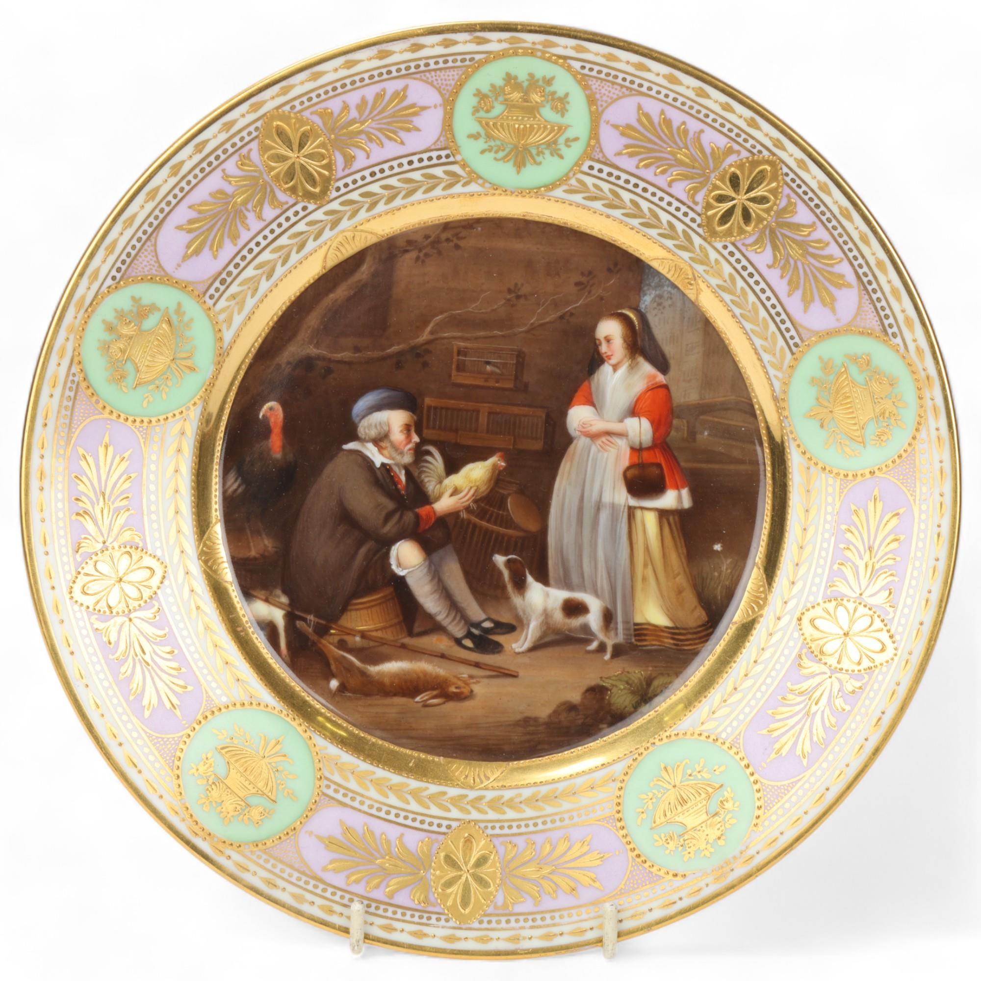 A Vienna porcelain plate depicting a bird handler, gilded border, diameter 25.5cm Perfect condition