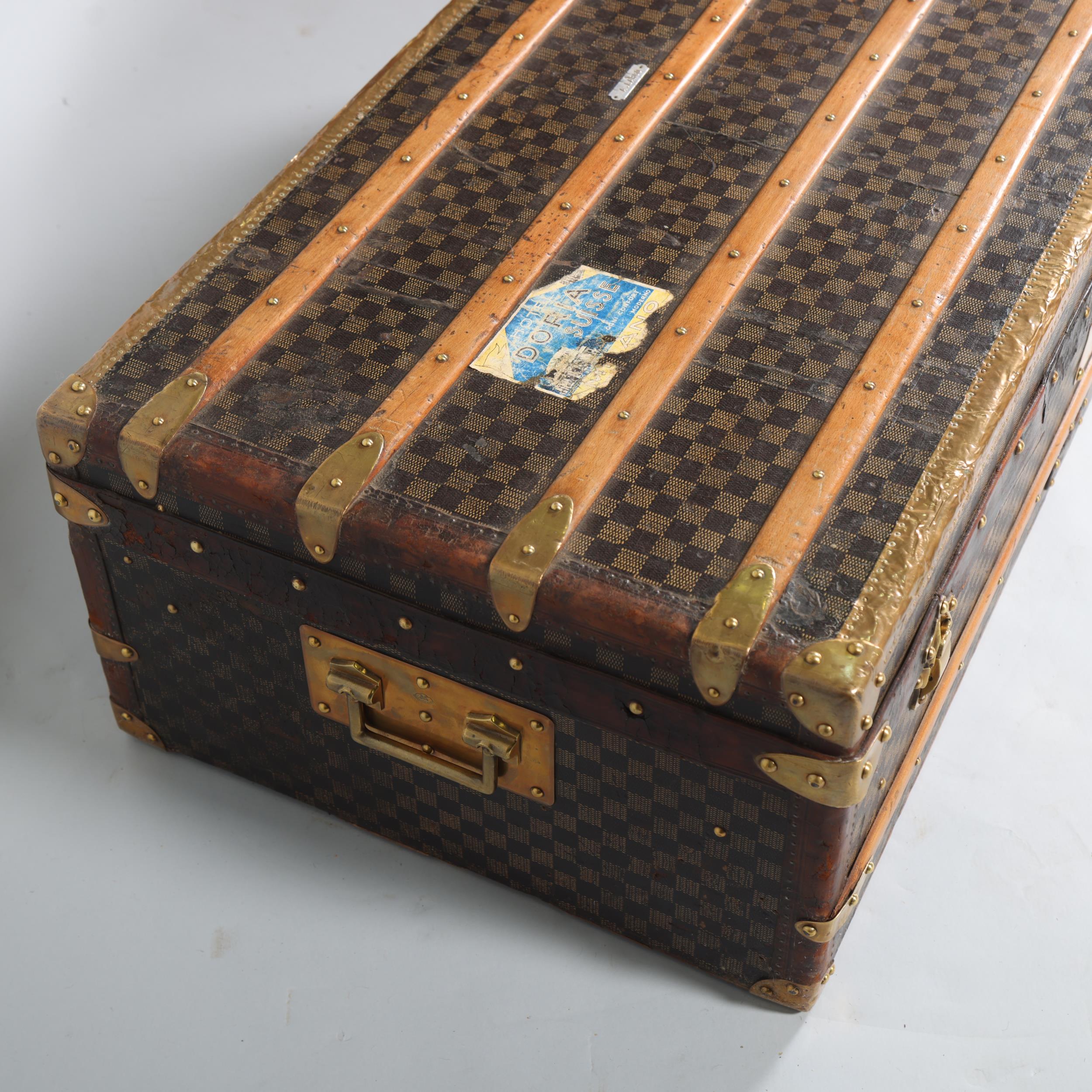 A Vintage French travelling trunk, brass wood and leather-bound with printed canvas panels, Damier - Image 3 of 6