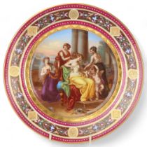 A Vienna porcelain plate depicting Venus and Cupid, diameter 24.5cm Good condition, gilding slightly