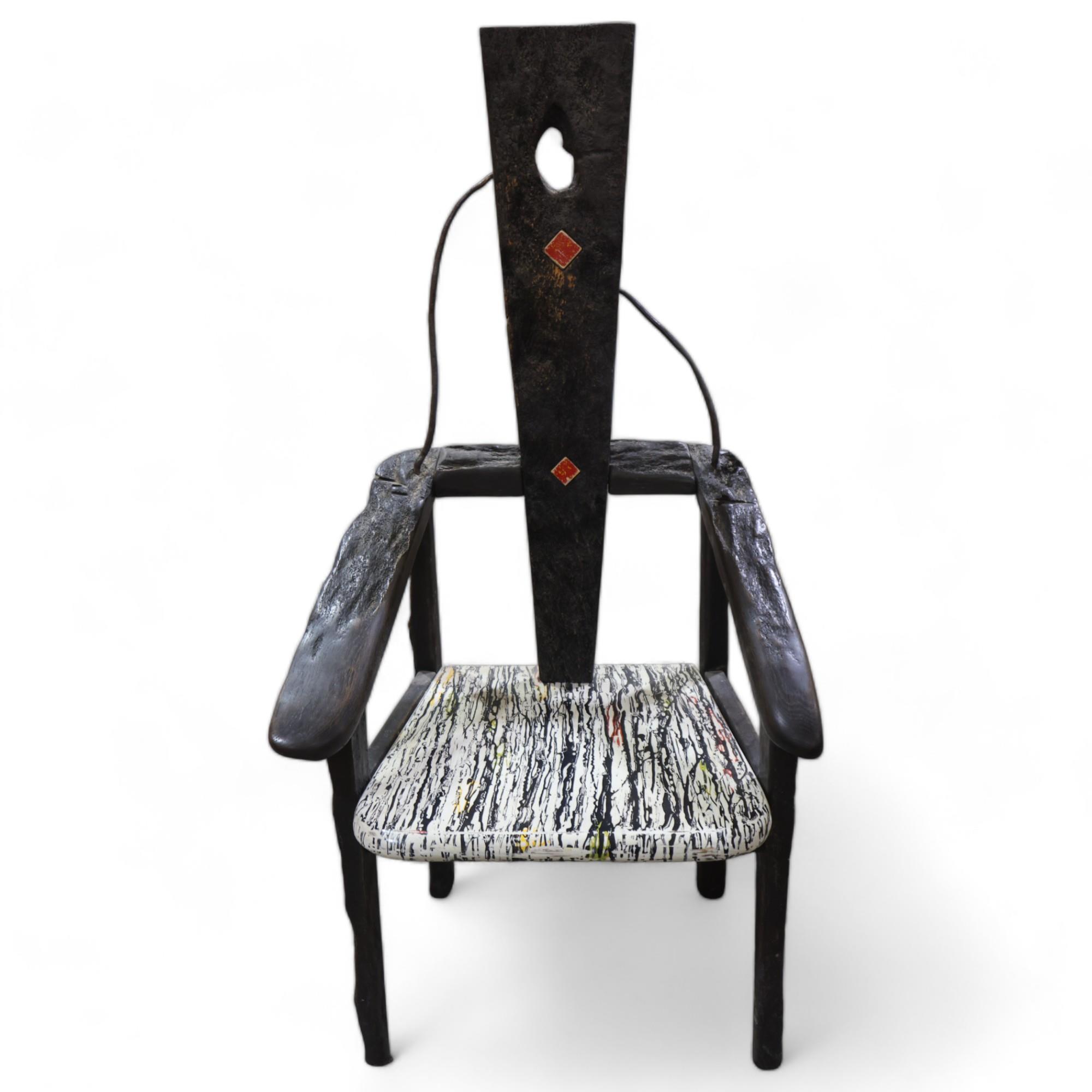 TERRY WARREN, a hand made ebonised driftwood armchair, with marble painted seat and painted insert