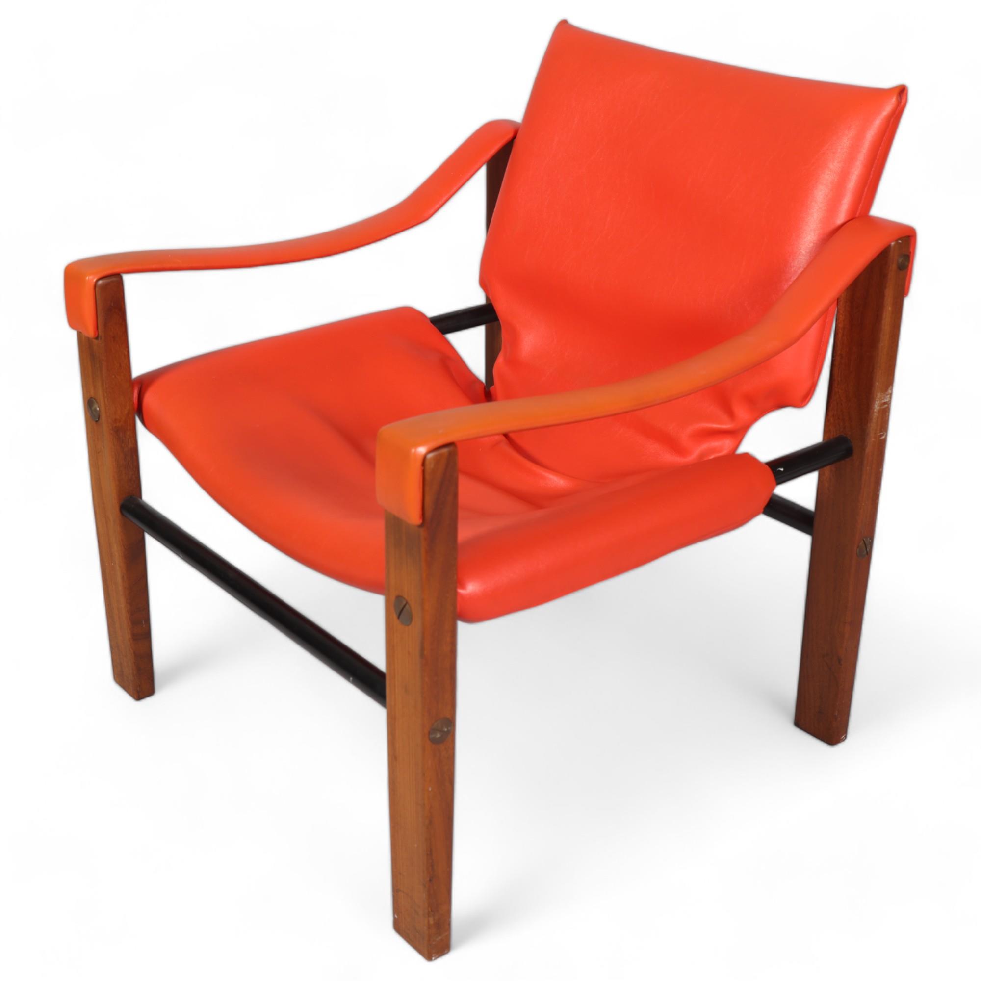 MAURICE BURKE for Arkana, a mid 20th century safari chair, red faux leather upholstery with hardwood
