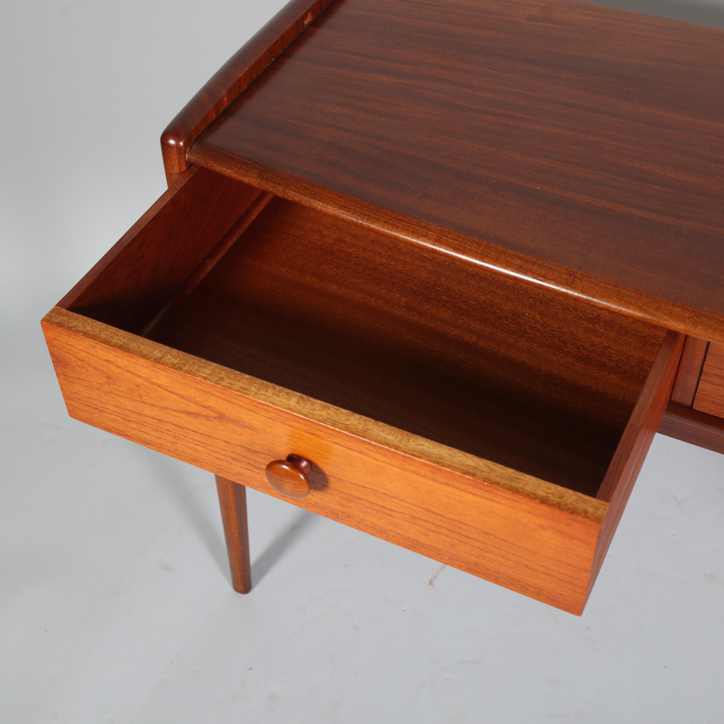 JOHN HERBERT for A Younger Ltd, a teak console table or desk with two drawers, makers label to - Image 4 of 6