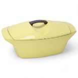 RAYMOND LOWEY for Le Cruset, a 1950s' La Coquelle cast-iron cooking pot, with yellow enamel,