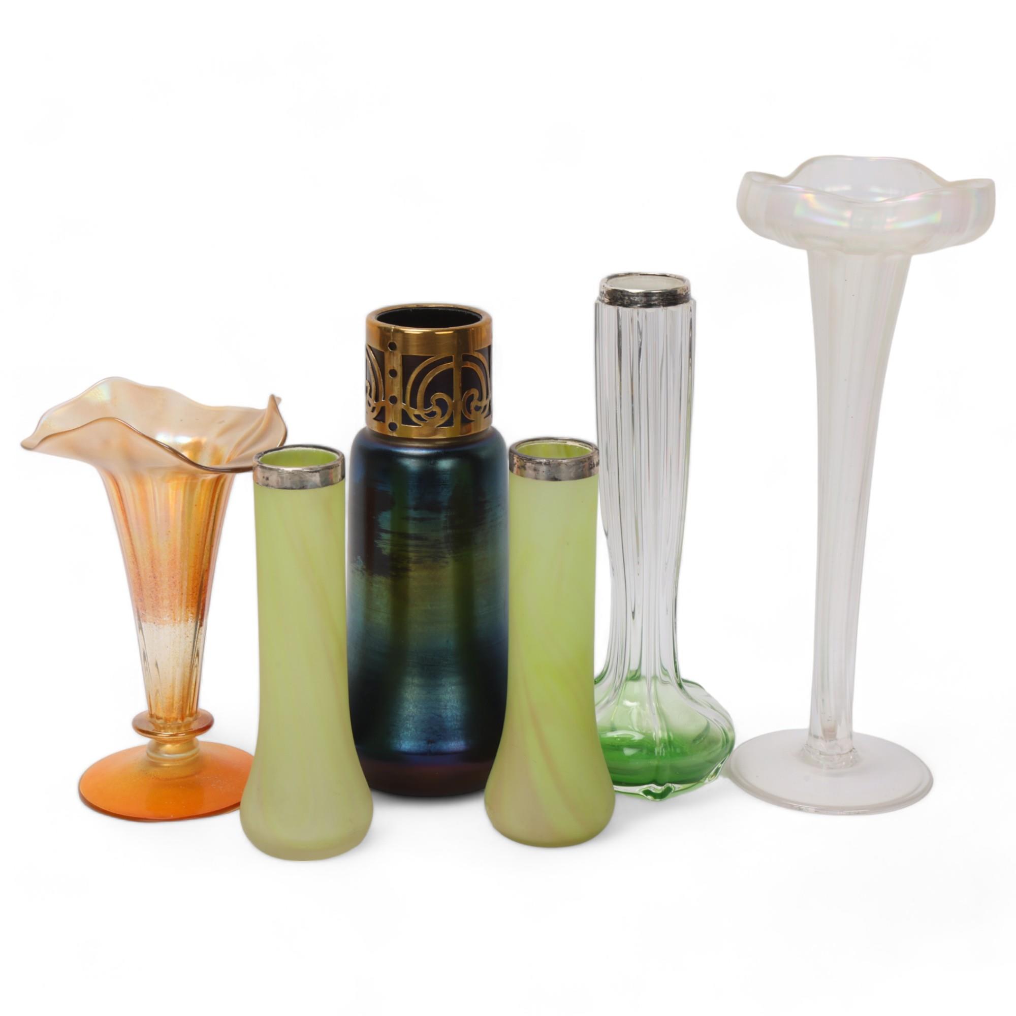 A group of Art Nouveau iridescent glass items, including a brass-mounted Loetz style vase, height