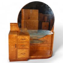 Art Deco satinwood dressing table, circa 1920, circular mirror-back with end cupboard, central 3-