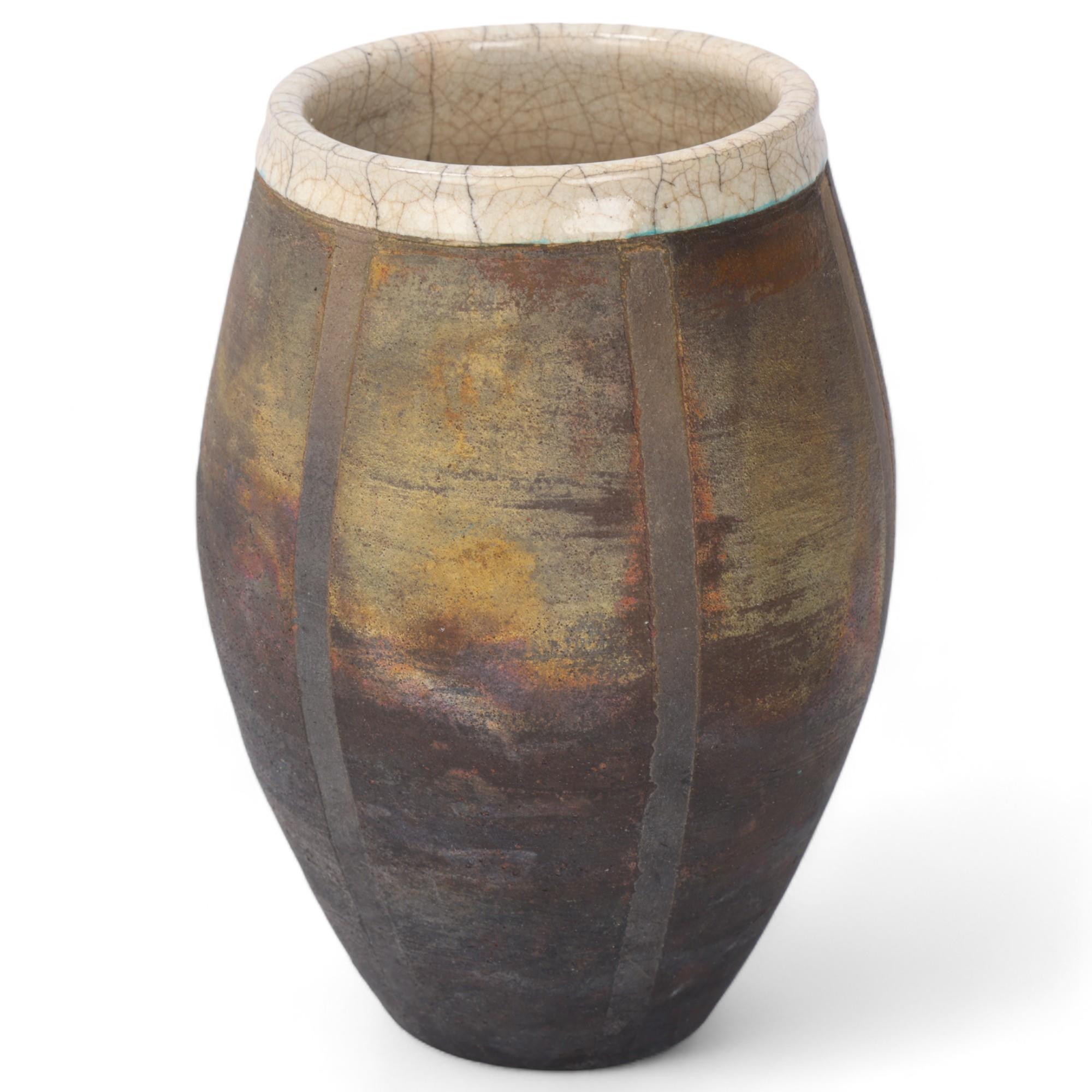 A studio pottery raku fired barrel vase, with resist stripes and crackle glaze interior, makers mark