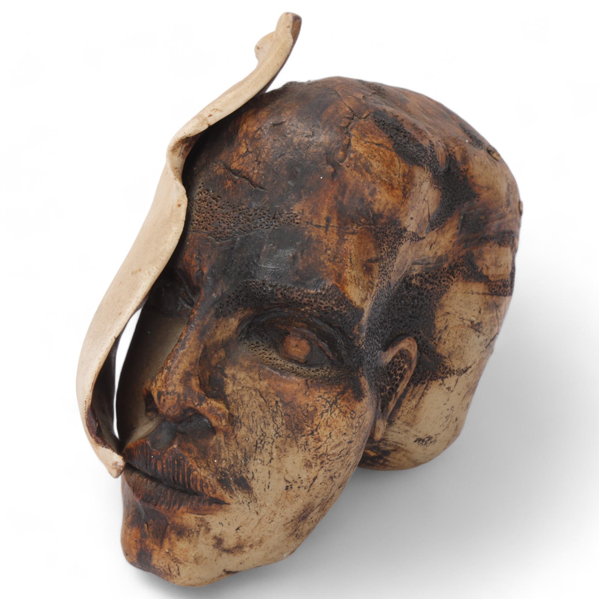 A South African ceramic sculpture depicting the calcification of the ear in deep sea diving,